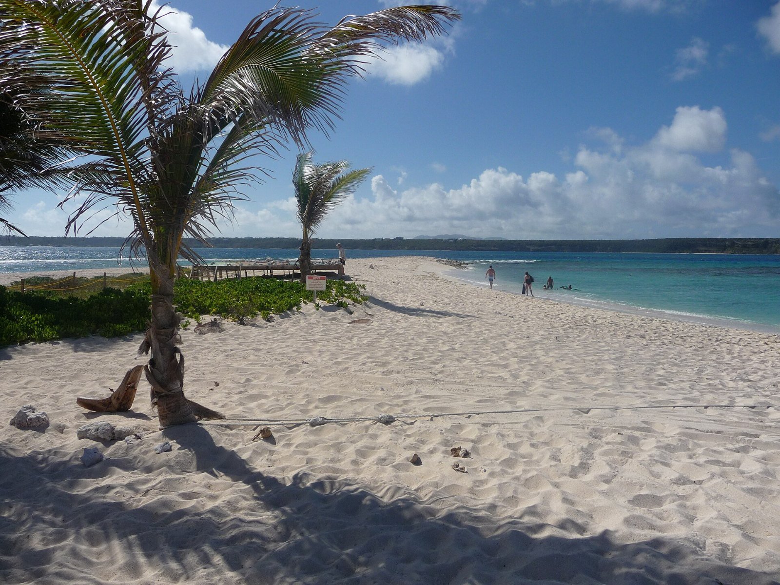 Small sandy cay surrounded by turquoise water off Anguilla