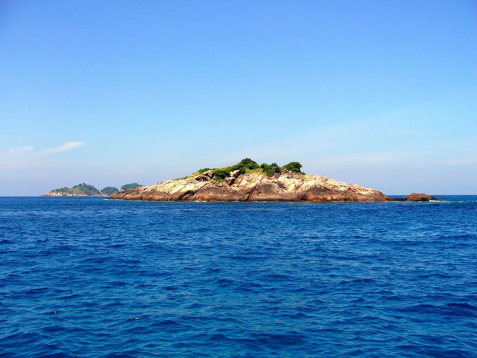 Small islet off Pulau Redang, Malaysia, clear reef water