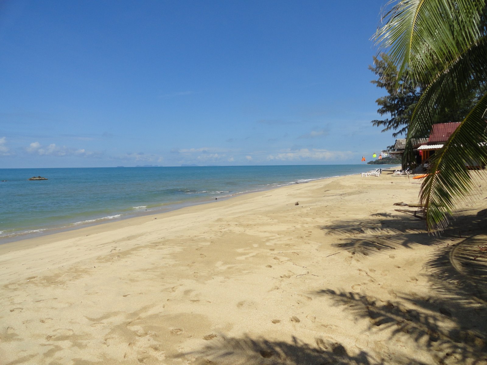 Klong Nin Beach, Koh Lanta, Thailand, palm-lined sand and calm sea