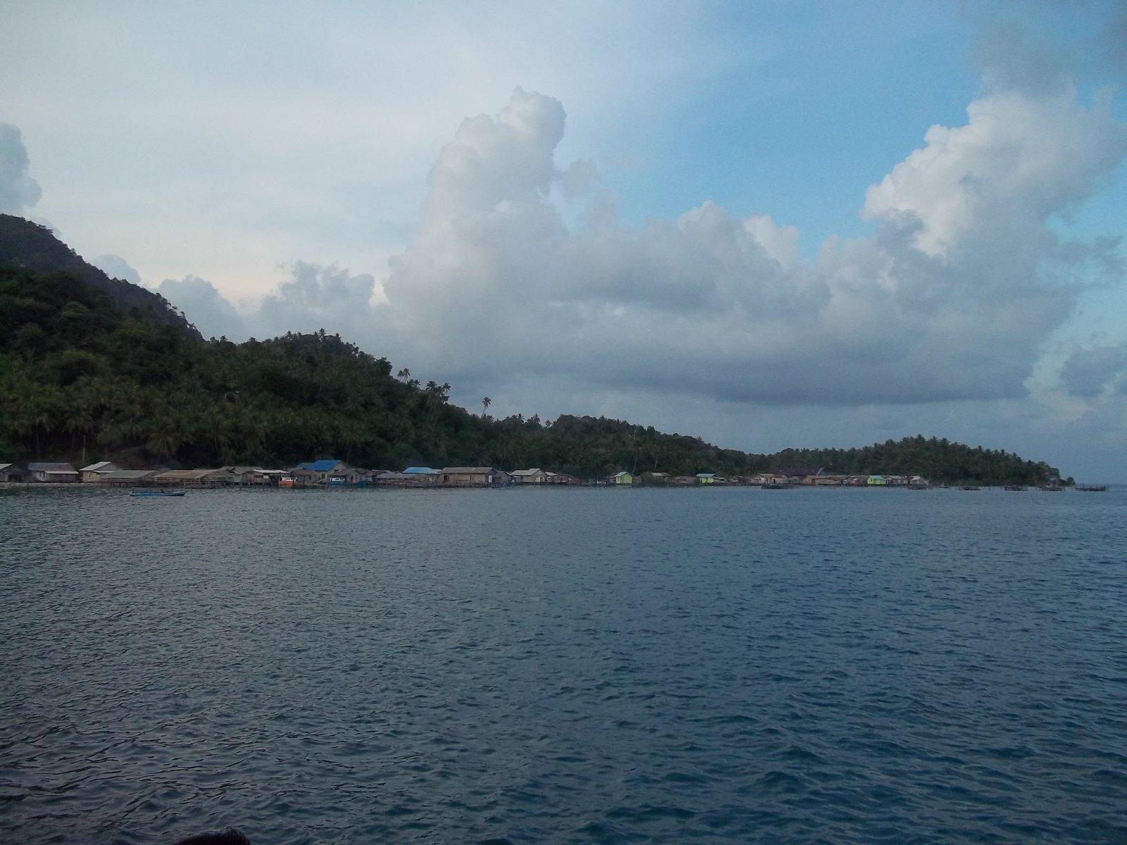 Illustrative Natuna Islands harbor scenery; not a photograph of a specific dive site or resort