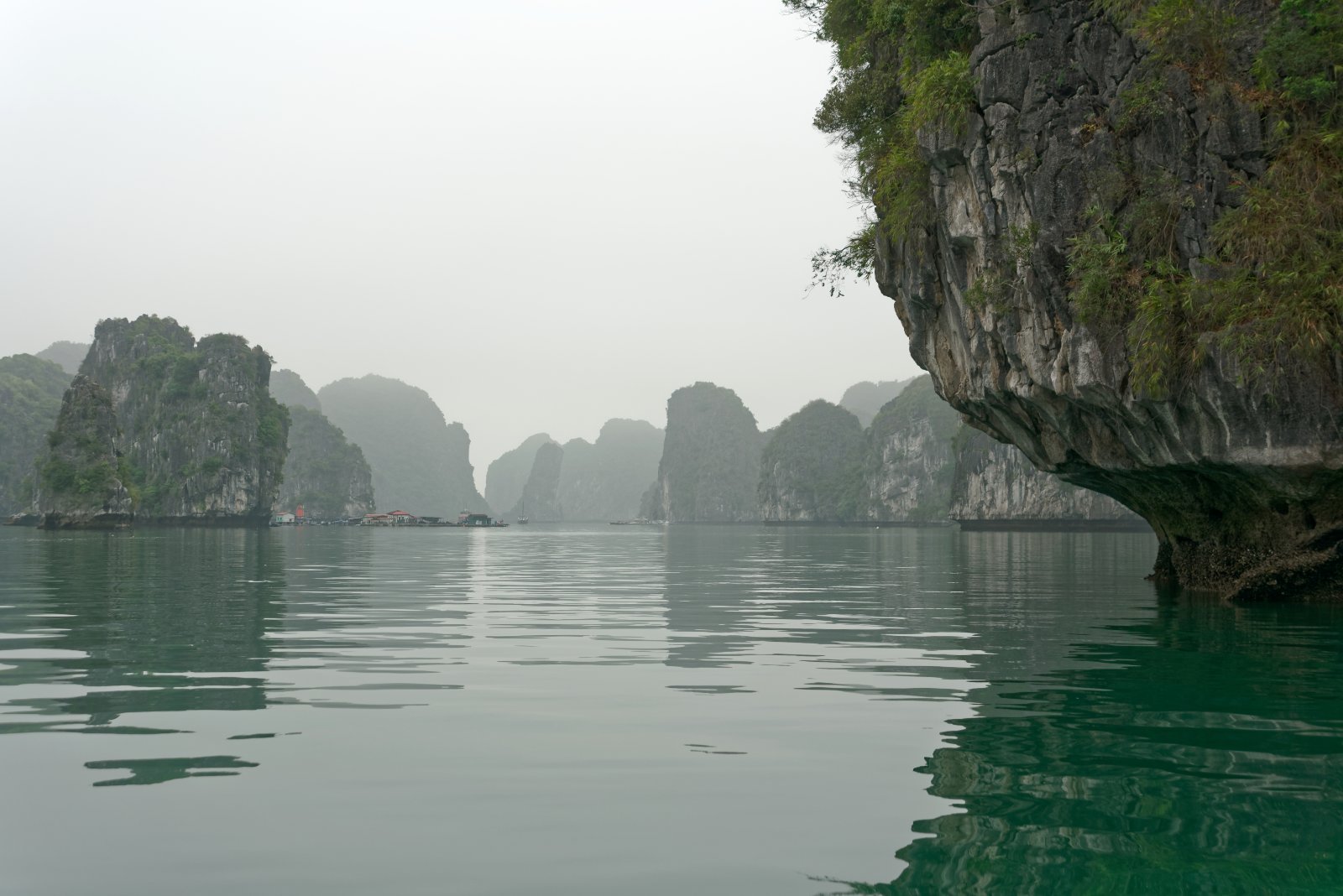 Limestone karst islands and turquoise water near Cat Ba Island, Vietnam