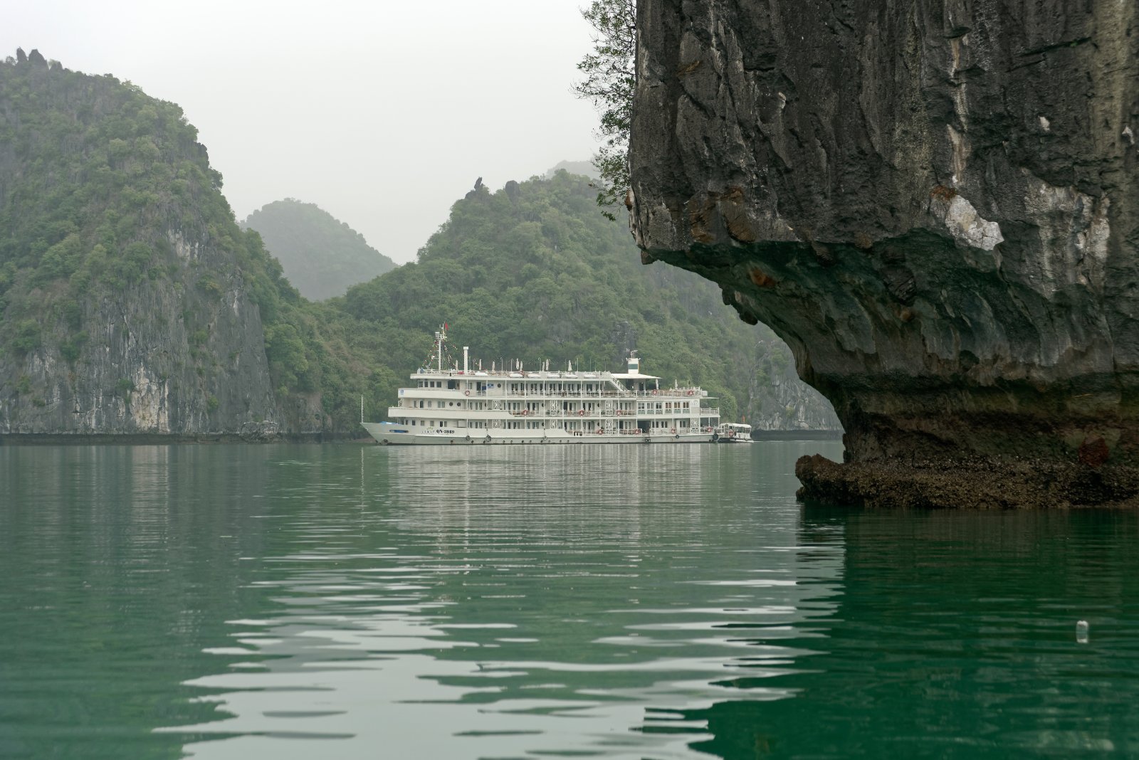 Limestone karst islets rising from turquoise water near Cat Ba Island, Vietnam
