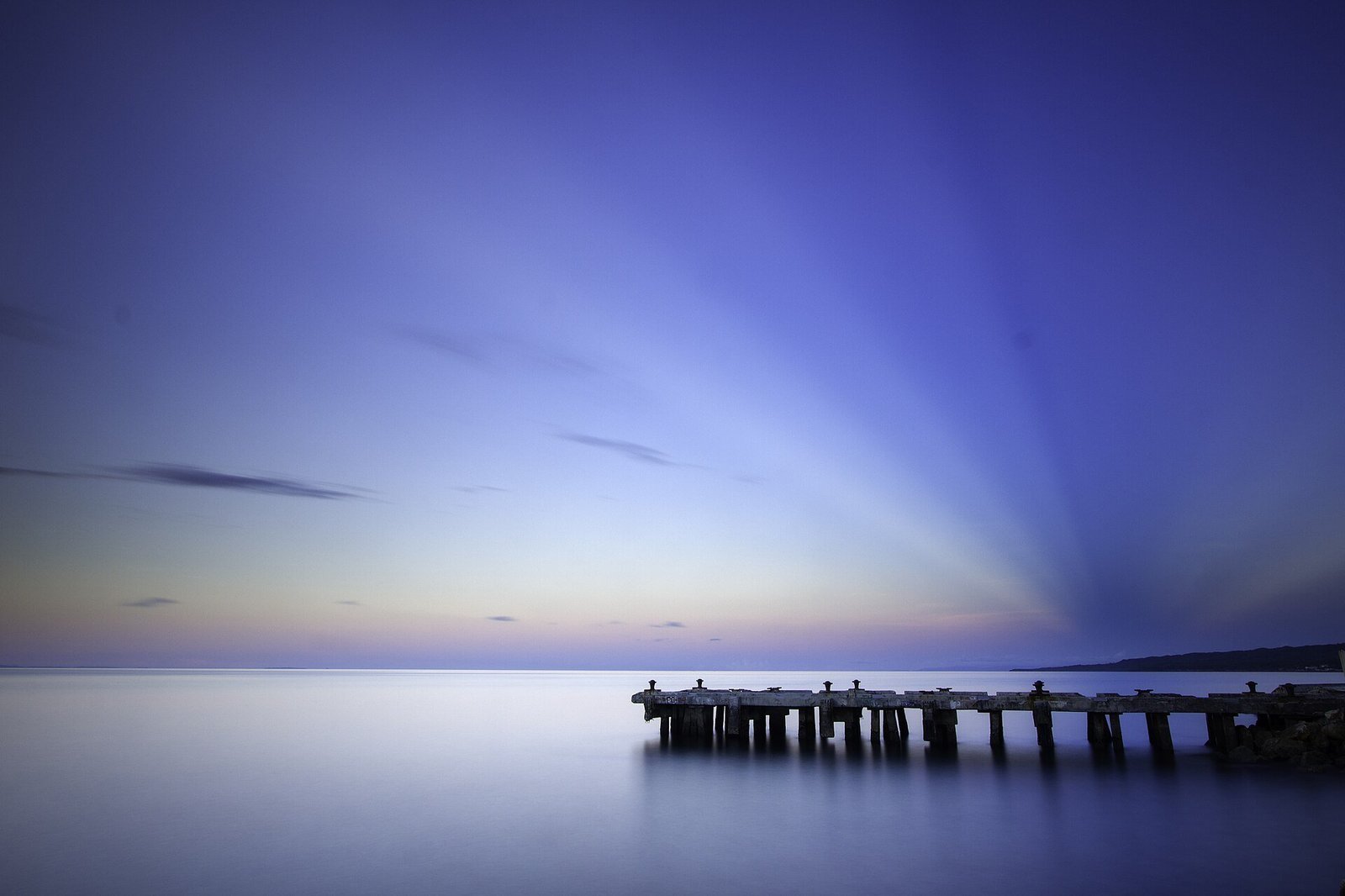 Illustrative pier scene in the Camotes Islands; not a specific resort or operator shown below