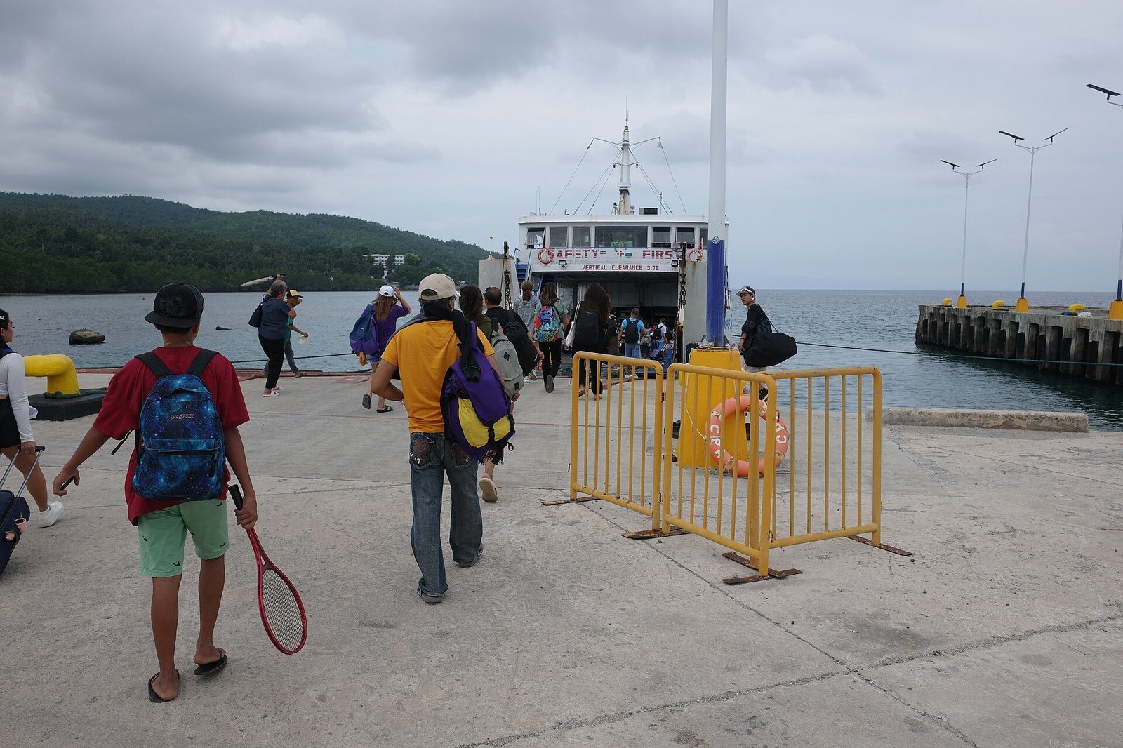 Illustrative ferry port scene near the Camotes Islands; not a specific operator shown below