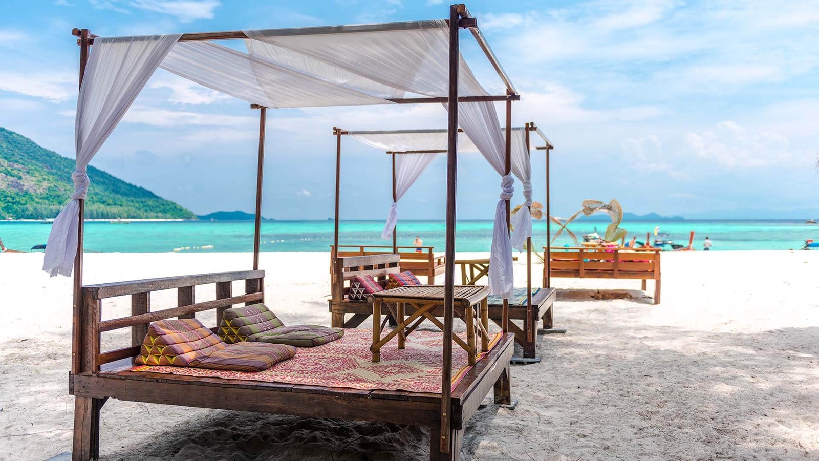 Longtail boats on the white sand beach of Koh Lipe, Thailand