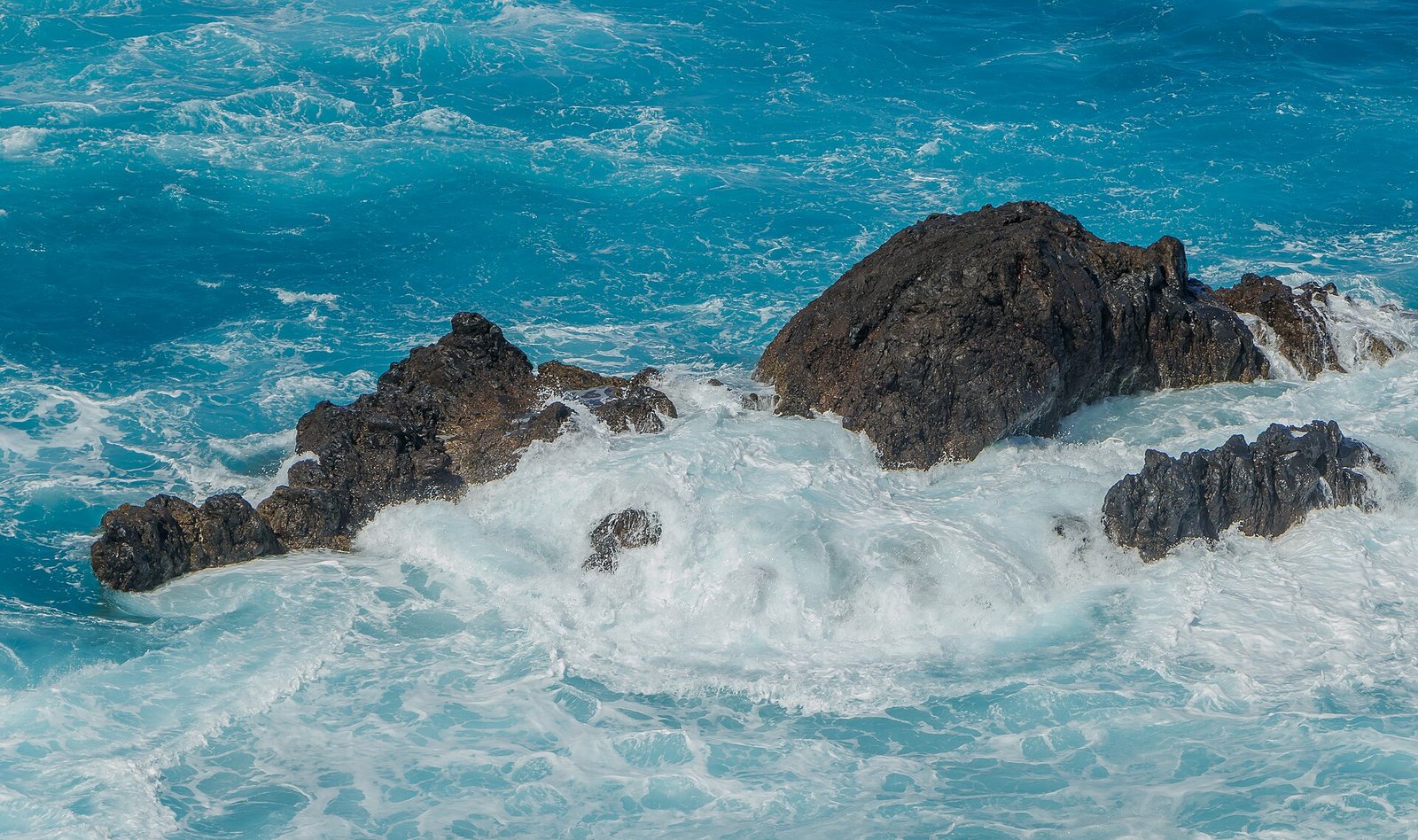 Rugged coastline and natural rock pools at Porto Moniz on Madeira