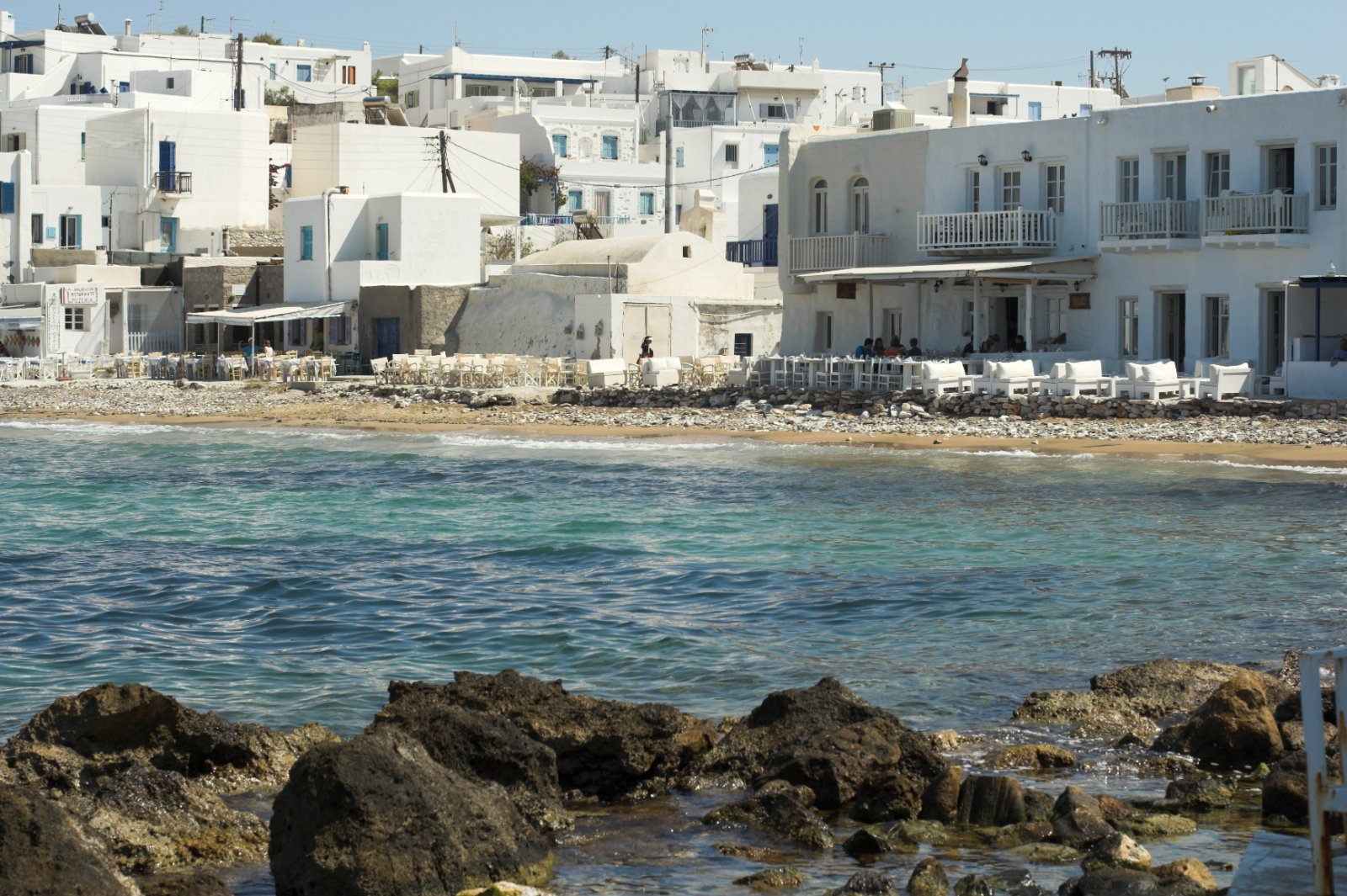 Naoussa harbour on Paros island with fishing boats and whitewashed buildings