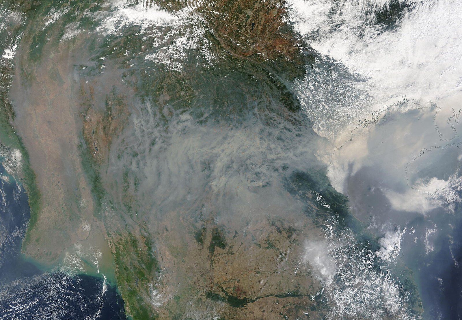 A thick gray pall from hundreds of fires burning in Southeast Asia blanketed the skies in early April 2023. The Moderate Resolution Imaging  — Photo: MODIS Land Rapid Response Team, NASA GSFC, Public domain, via Wikimedia Commons