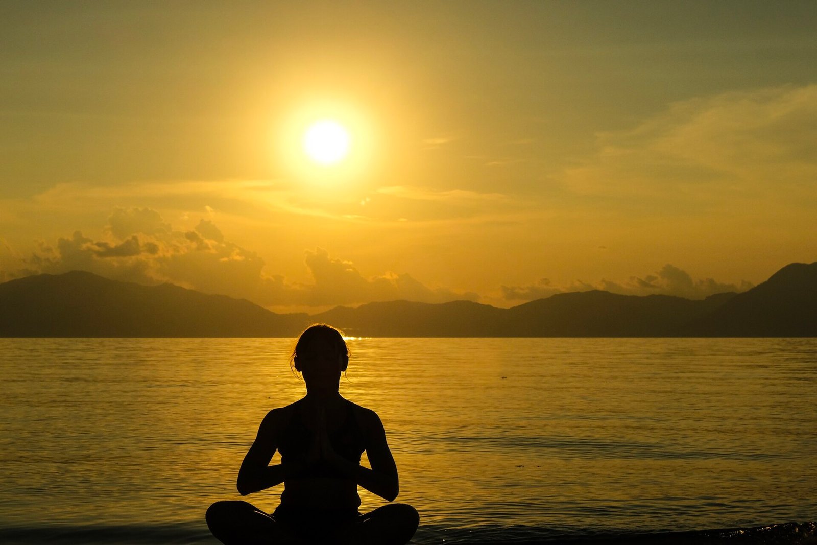 Calm sea and pale sand at sunset on Bonbon beach, Romblon, Philippines