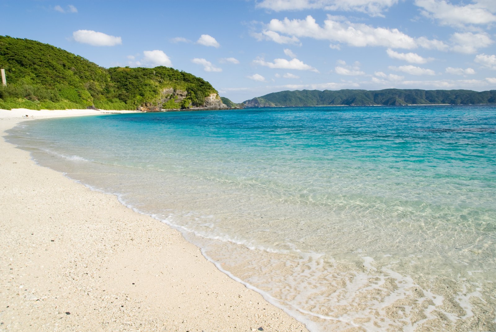 Turquoise water and white sand at Furuzamami Beach on Zamami Island, Okinawa